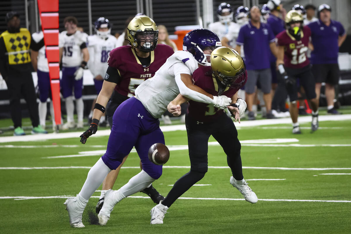 Spanish Springs defensive end Isaiah Blinkinsop (4) sacks Faith Lutheran quarterback Dominick F ...