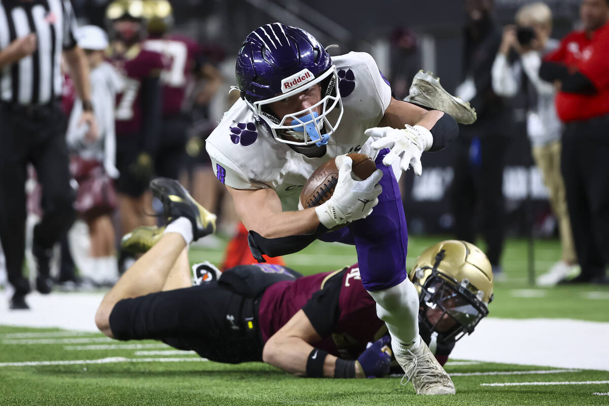 Spanish Springs’ Cooper Milligan (8) scores a touchdown against Faith Lutheran during se ...