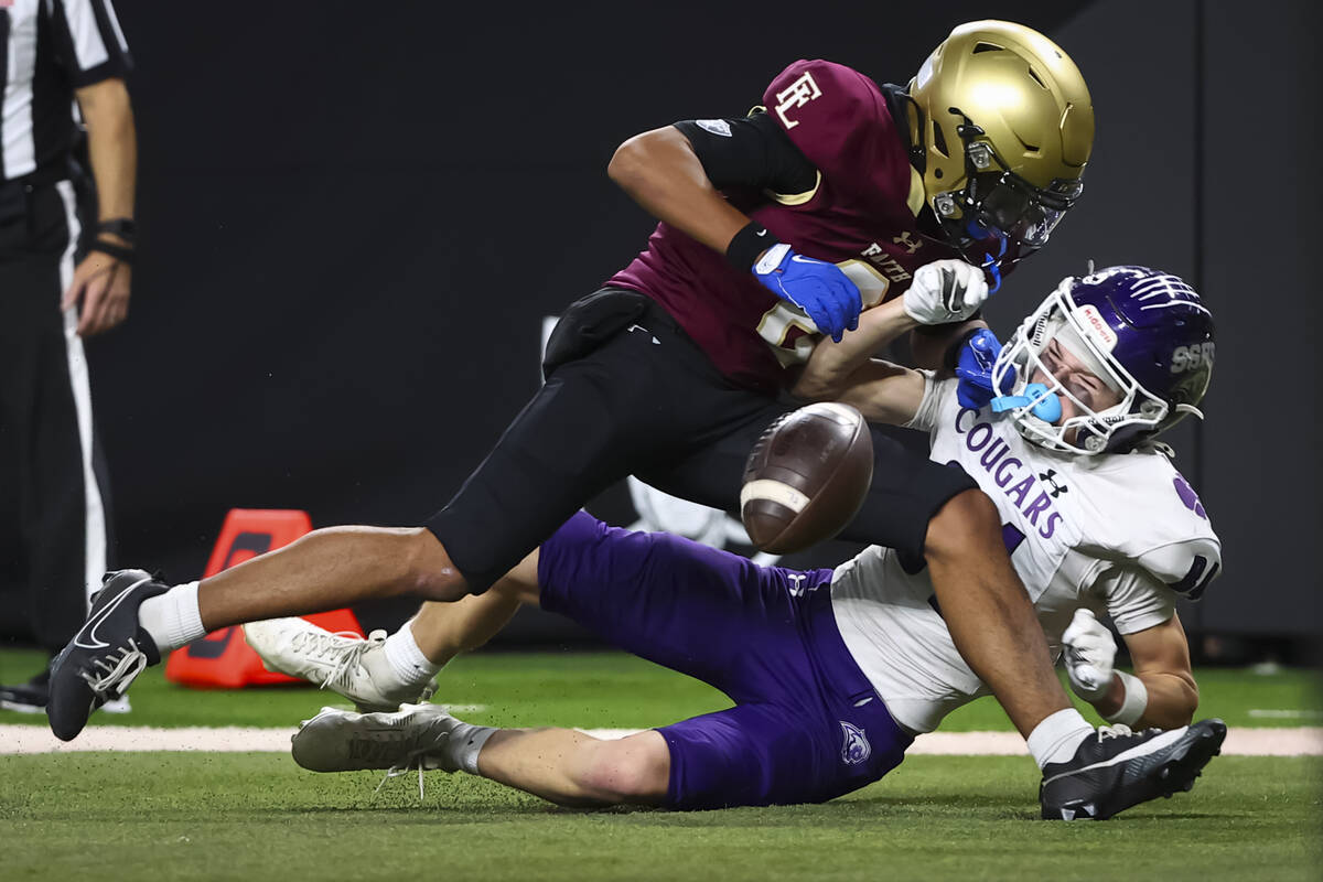 Faith Lutheran defensive back Ace Brimmer (8) breaks up a pass intended for Spanish Springs wid ...