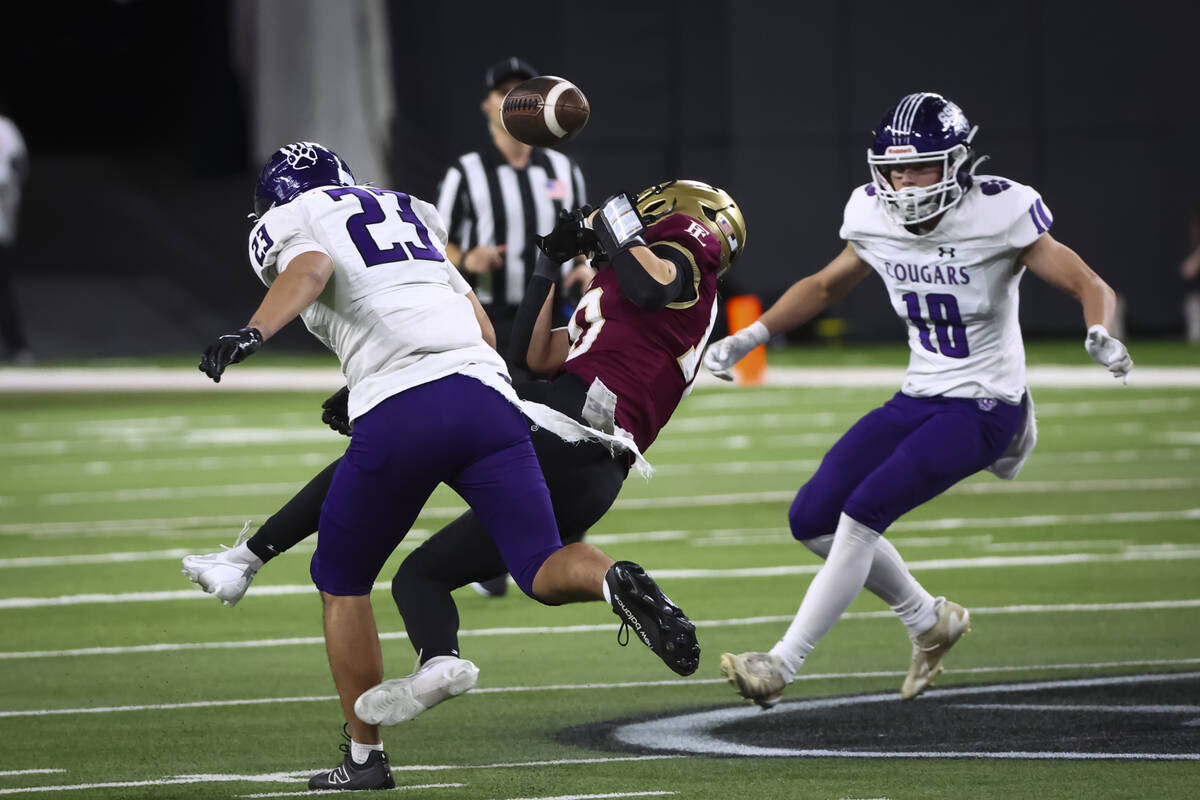 Spanish Springs cornerback Jayden Acosta (23) breaks up a pass intended for Faith Lutheran wide ...