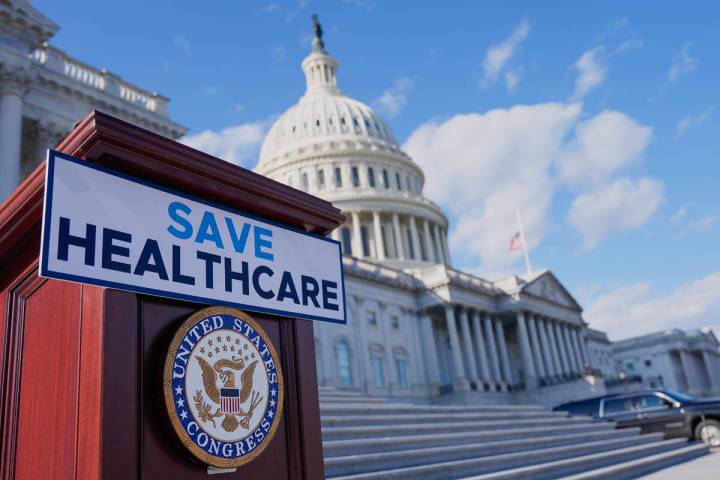 A podium is prepared before Democrats hold news conference on the health care funding fight on ...