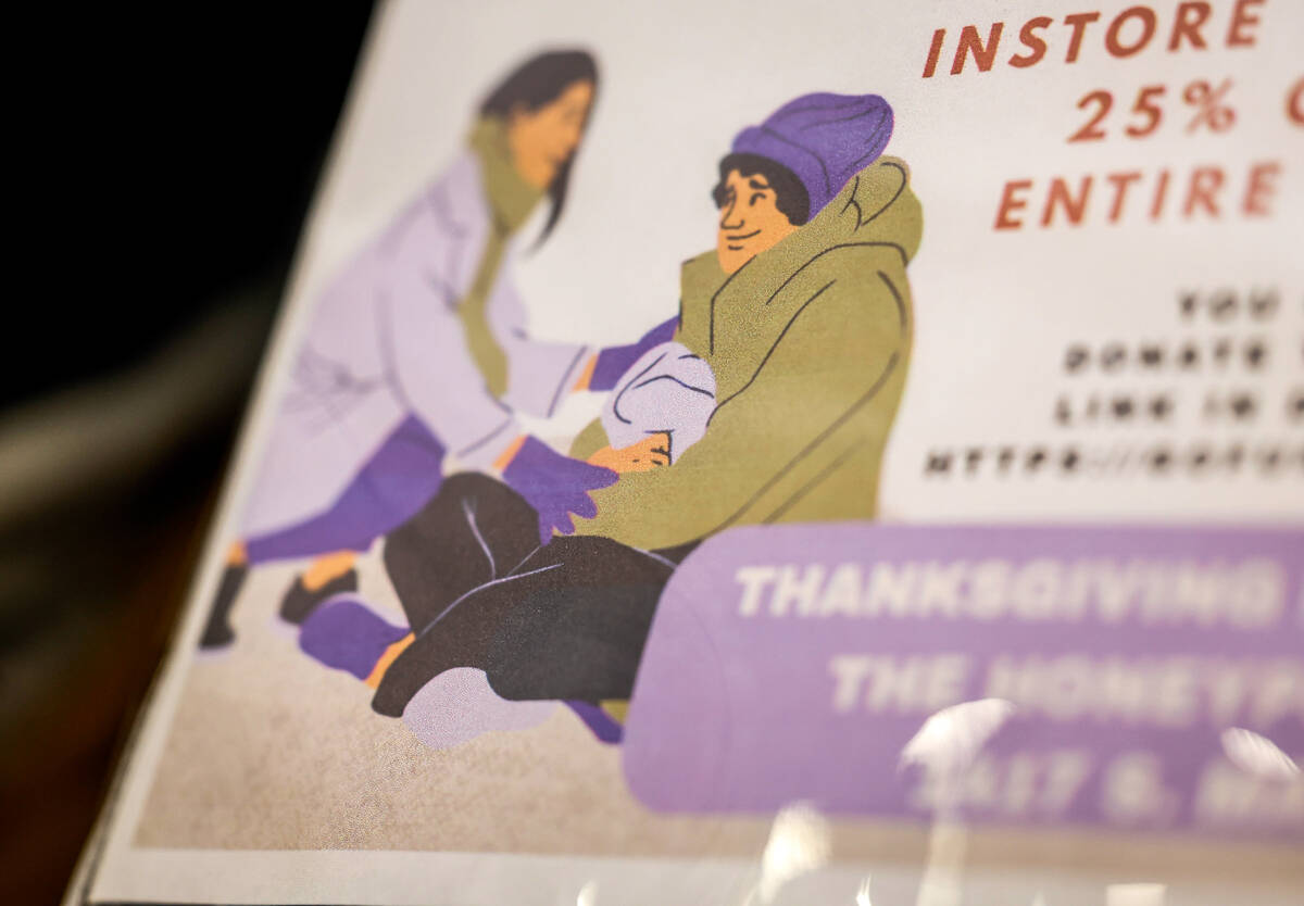 Signage paired with donated food and supplies at The Honey Pot Wednesday, Nov. 26, 2025, in Las ...