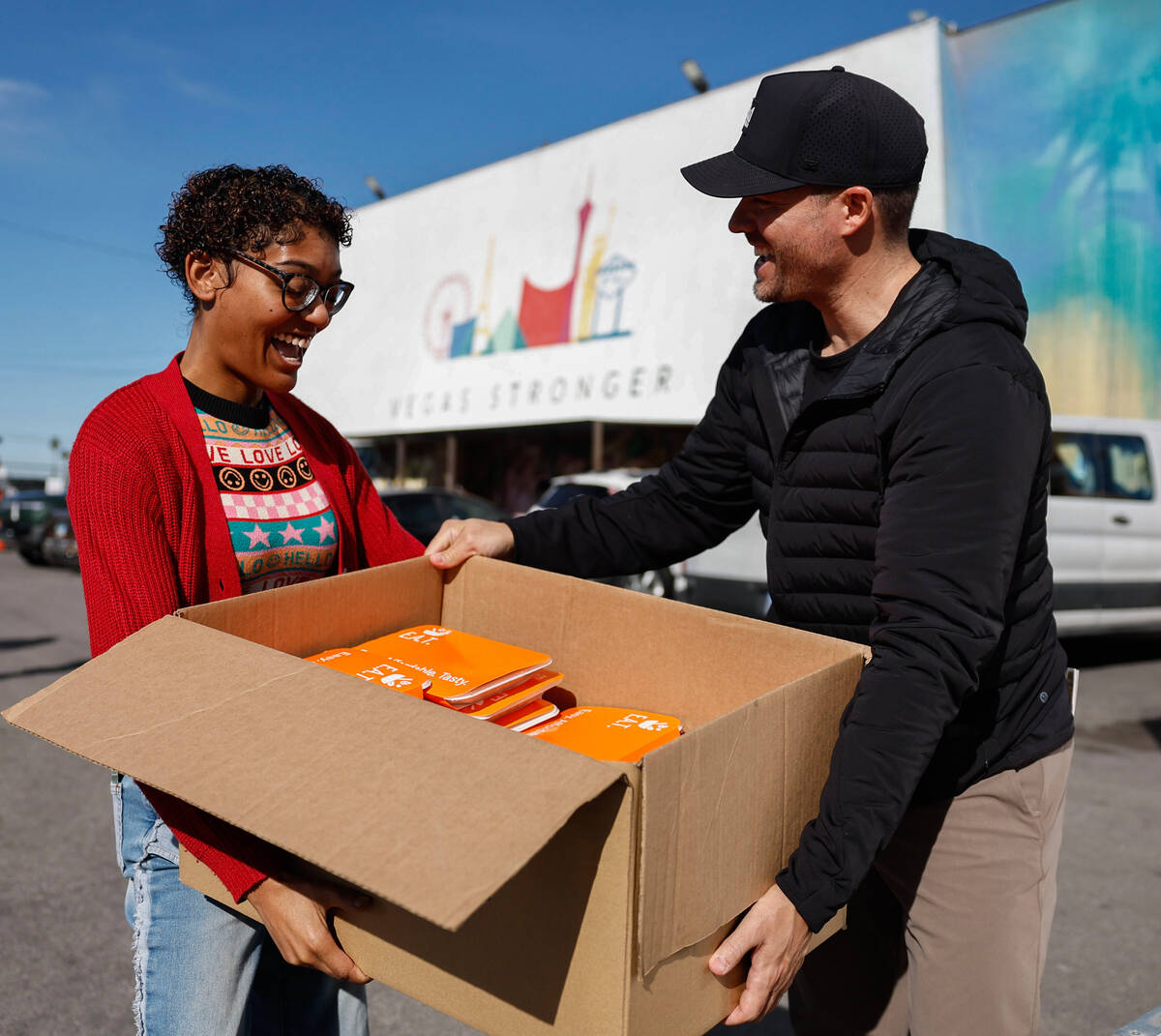 Tamaira Lampkin, left, property manager at Barlow Senior Living Apartments, is helped to her ca ...