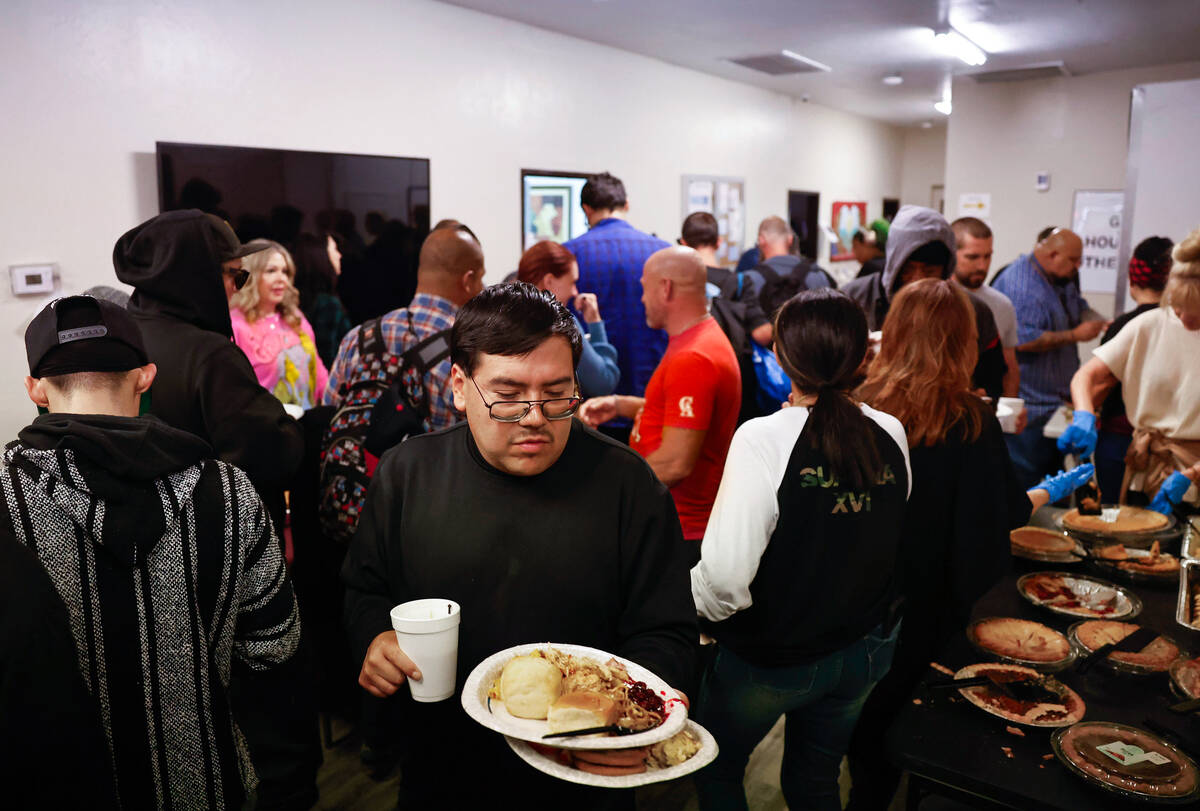 Guests make their way through the line during holiday meal service at Vegas Stronger Wednesday, ...