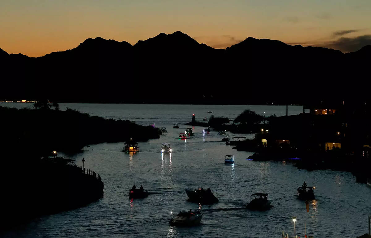 Boaters navigate a channel that separates Lake Havasu City from Lake Havasu Island.(Brian van d ...