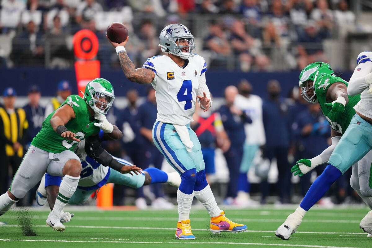 Dallas Cowboys quarterback Dak Prescott (4) throws a pass during the first half of an NFL footb ...