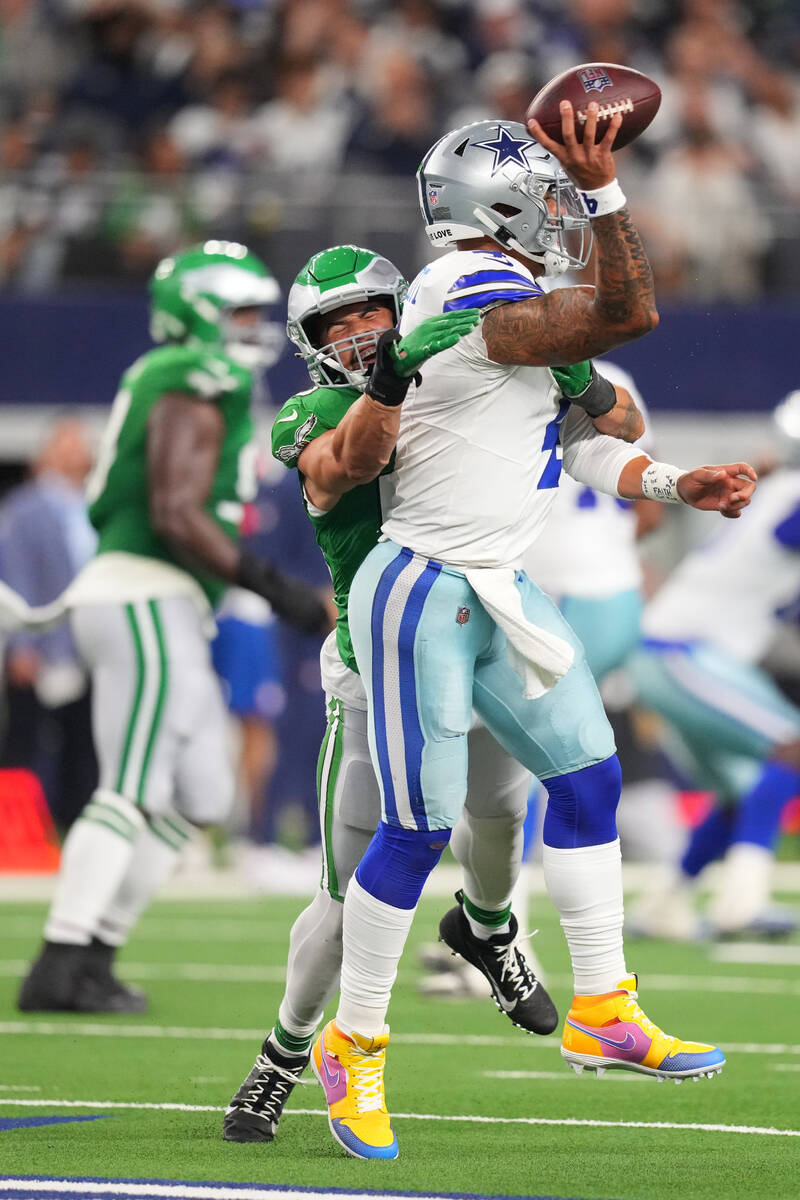 Dallas Cowboys quarterback Dak Prescott is hit by Philadelphia Eagles linebacker Zack Baun (53) ...