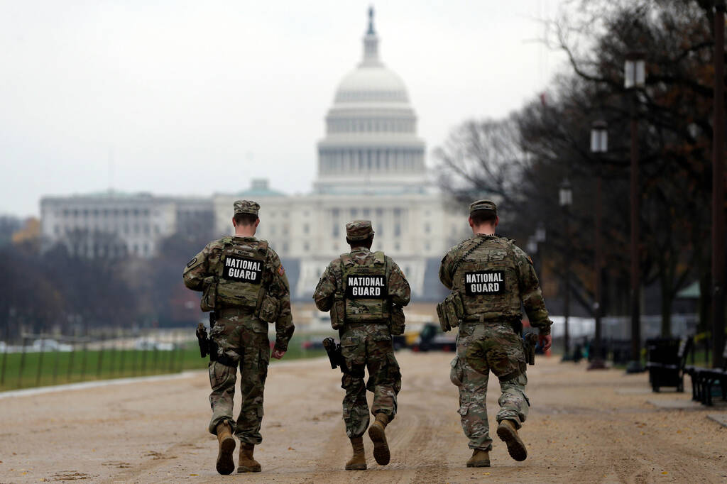 National Guard patrol along the National Mall in front of the Capitol, Wednesday, Nov. 26, 2025 ...
