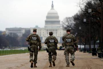 National Guard patrol along the National Mall in front of the Capitol, Wednesday, Nov. 26, 2025 ...