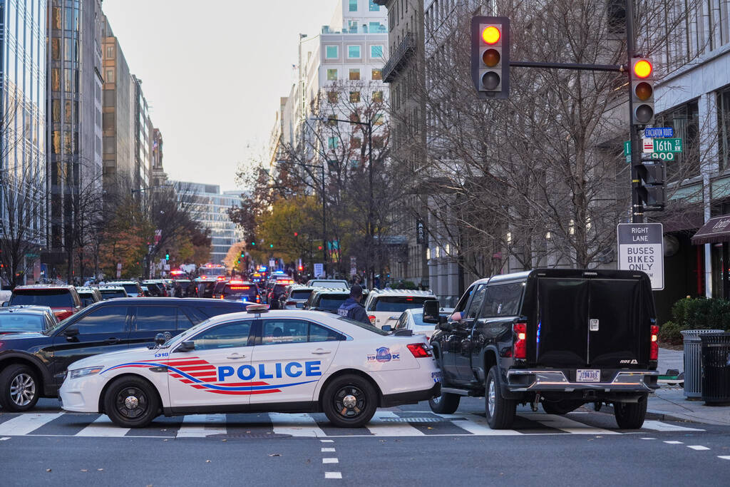 Streets are blocked after reports of two National Guard soldiers were shot near the White House ...