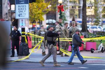 U.S. Marshalls and National Guard troops are seen after reports of two National Guard soldiers ...