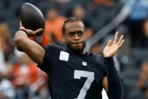 Raiders quarterback Geno Smith (7) throws a pass during a warm up before an NFL football game a ...