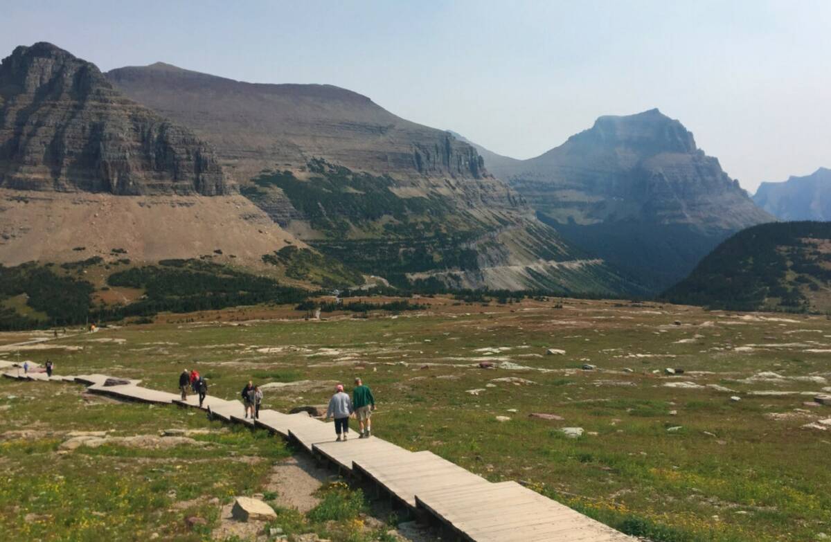 People hike at Glacier National Park in Montana. (AP Photo/Beth J. Harpaz, File)