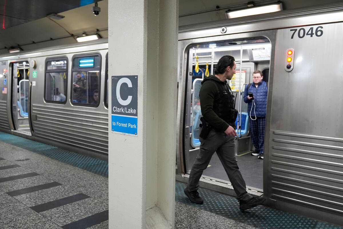 A Chicago police officer patrols the Clark Street and Lake Street Blue Line stop where a man do ...
