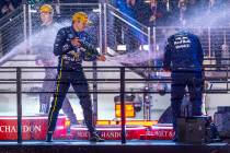 Red Bull driver Max Verstappen, left, celebrates his win in the Las Vegas Grand Prix on Saturda ...