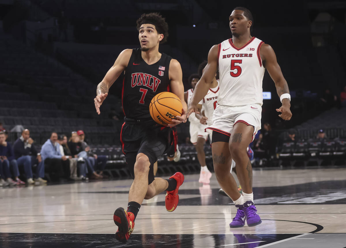 UNLV guard Al Green (7) drives to the basket in front of Rutgers guard Darren Buchanan Jr. (5) ...