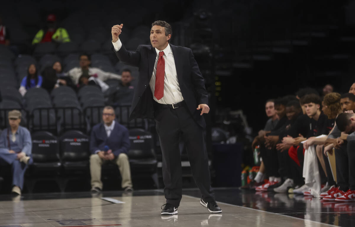 UNLV head coach Josh Pastner directs his team during the first half of a game against Rutgers i ...