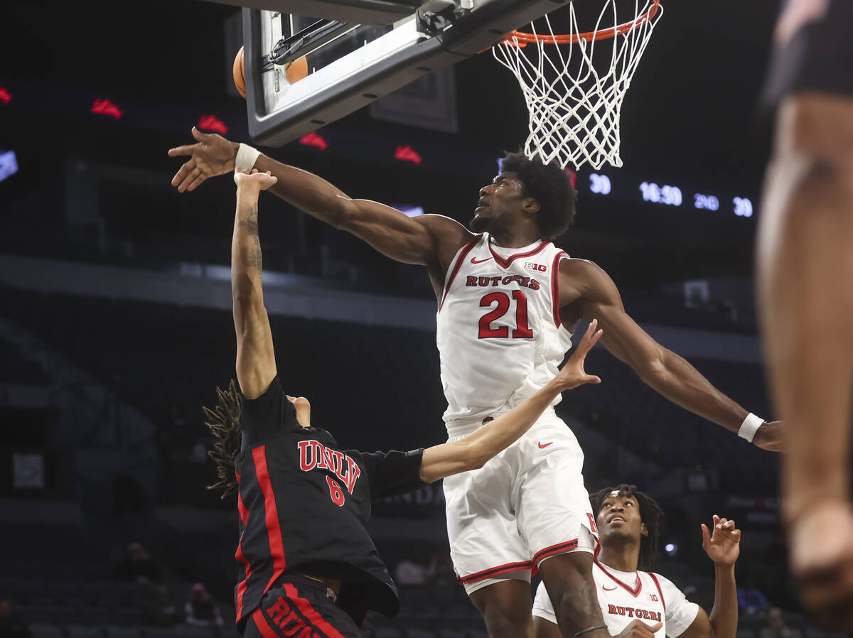 Rutgers center Emmanuel Ogbole (21) blocks the lay up of UNLV forward Tyrin Jones (6) during th ...