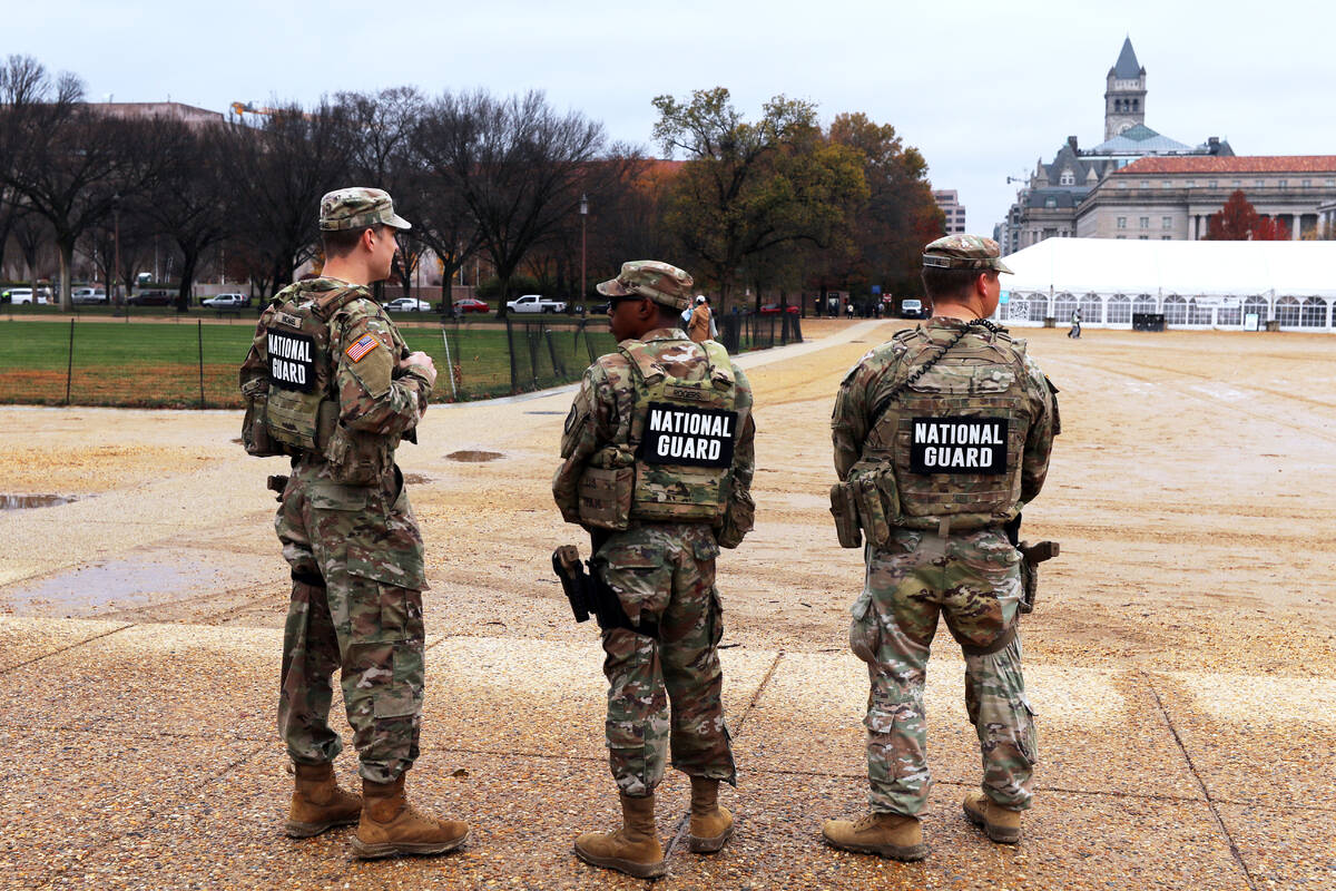 National Guard patrol on the National Mall near the U.S. Capitol, Wednesday, Nov. 26, 2025, in ...