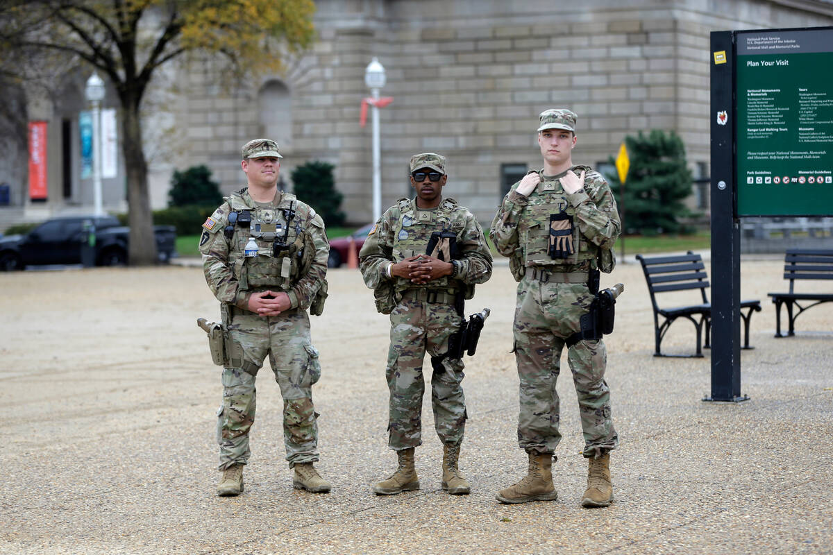 National Guard patrol on the National Mall near the U.S. Capitol, Wednesday, Nov. 26, 2025, in ...