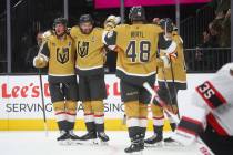 Golden Knights right wing Mark Stone, second from left, celebrates his goal with teammates duri ...