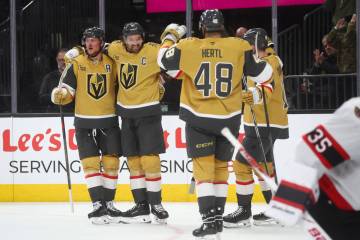 Golden Knights right wing Mark Stone, second from left, celebrates his goal with teammates duri ...