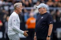 Raiders head coach Pete Carroll cuts with offensive coordinator Chip Kelly during the first hal ...