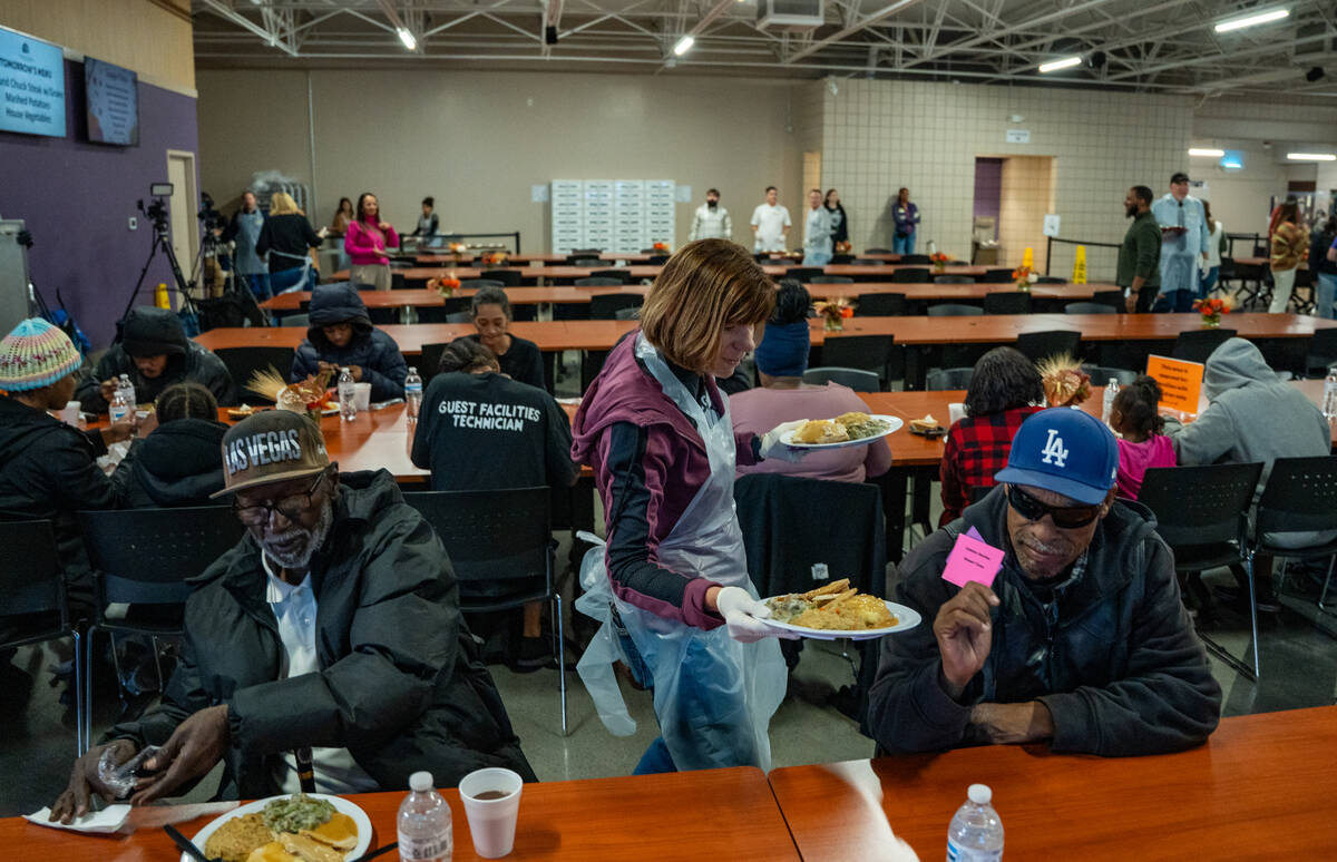 Thomas Winbush receives his meal during Catholic Charities of Southern Nevada’s 60th con ...