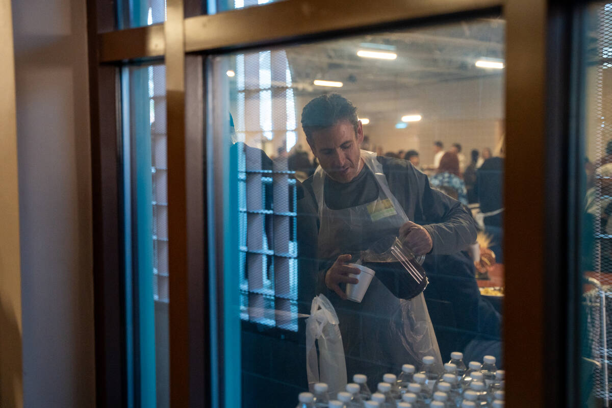 Volunteers pour drinks during Catholic Charities of Southern Nevada’s 60th consecutive f ...