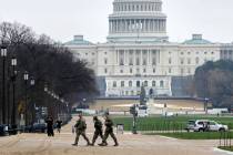National Guard patrol on the National Mall near the U.S. Capitol, Wednesday, Nov. 26, 2025, in ...