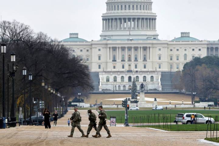 National Guard patrol on the National Mall near the U.S. Capitol, Wednesday, Nov. 26, 2025, in ...