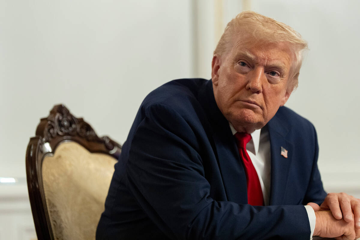 President Donald Trump speaks to reporters after speaking to troops via video from his Mar-a-La ...