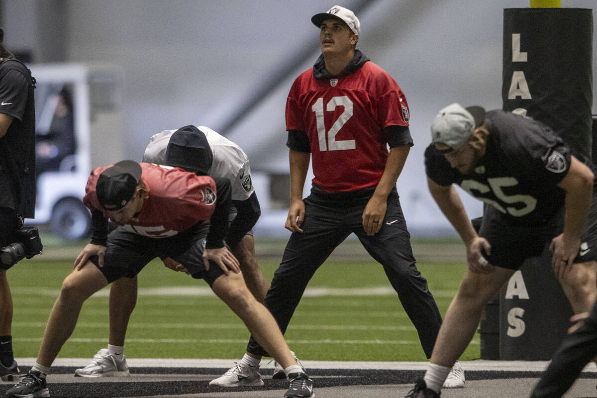 Raiders quarterback Aidan O'Connell (12) stretches during the team’s practice at th ...