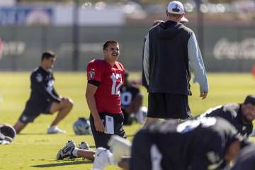 Raiders quarterback Aidan O'Connell (12) stretches during the team’s practice at th ...