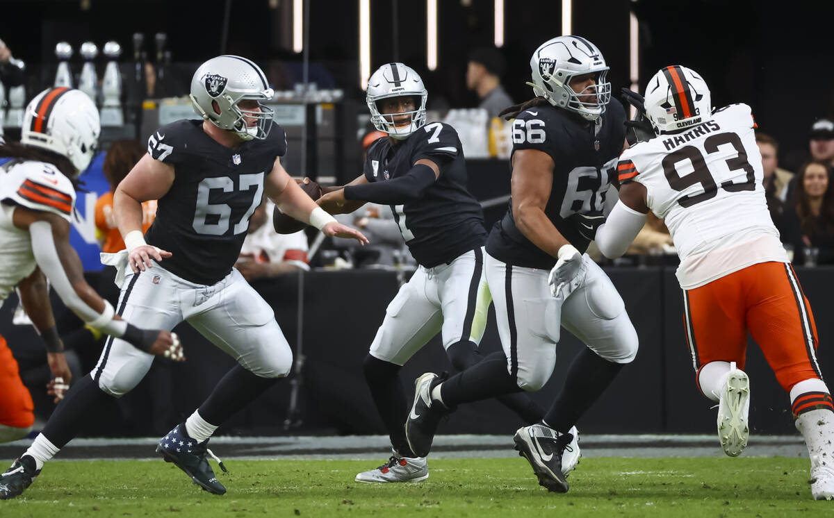 Raiders quarterback Geno Smith (7) looks to throw a pass during the first half of an NFL game a ...