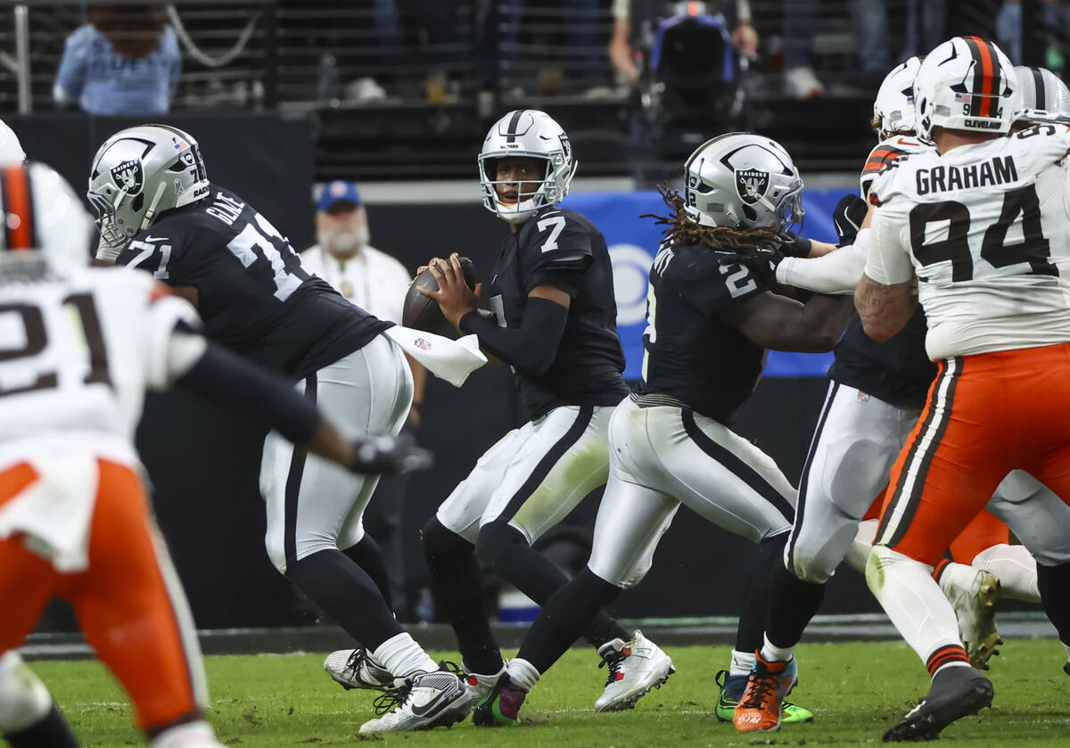 Raiders quarterback Geno Smith (7) looks to pass the ball during the first half of an NFL game ...
