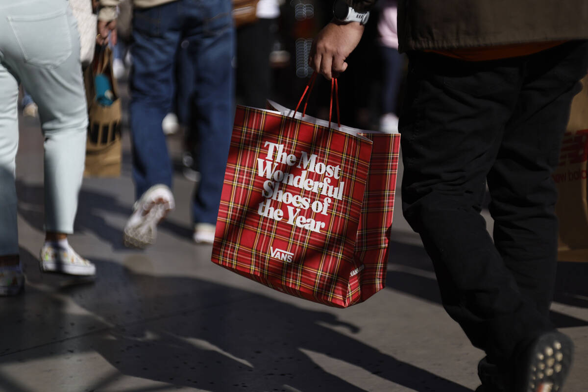 People shop during Black Friday at Las Vegas North Premium Outlets Friday, Nov. 28, 2025 in Las ...