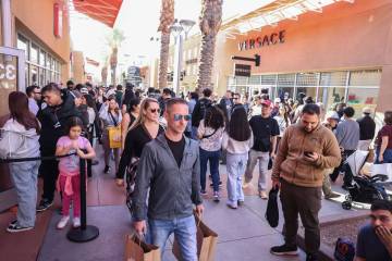 People shop during Black Friday at Las Vegas North Premium Outlets Friday, Nov. 28, 2025 in Las ...