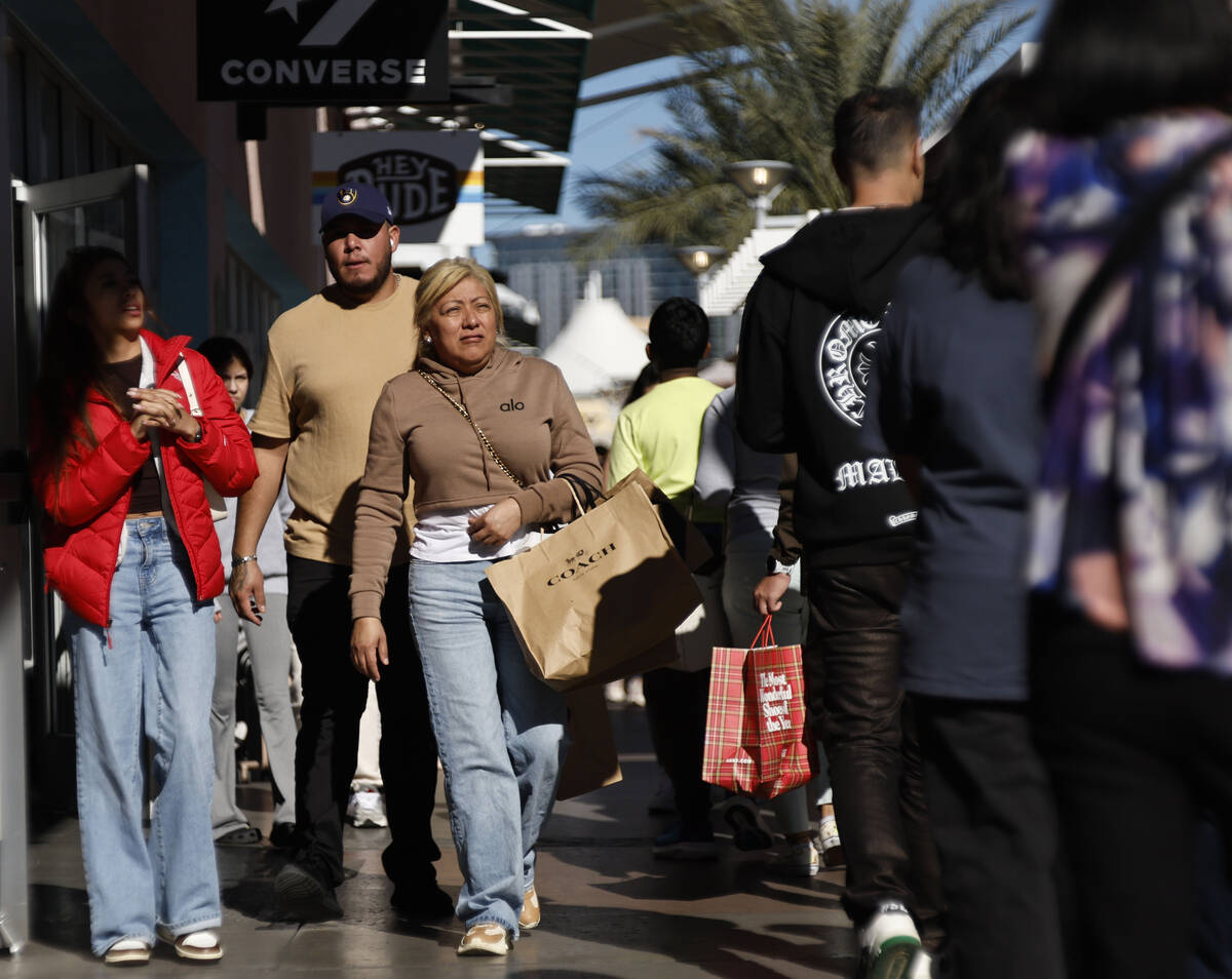 People shop during Black Friday at Las Vegas North Premium Outlets Friday, Nov. 28, 2025 in Las ...