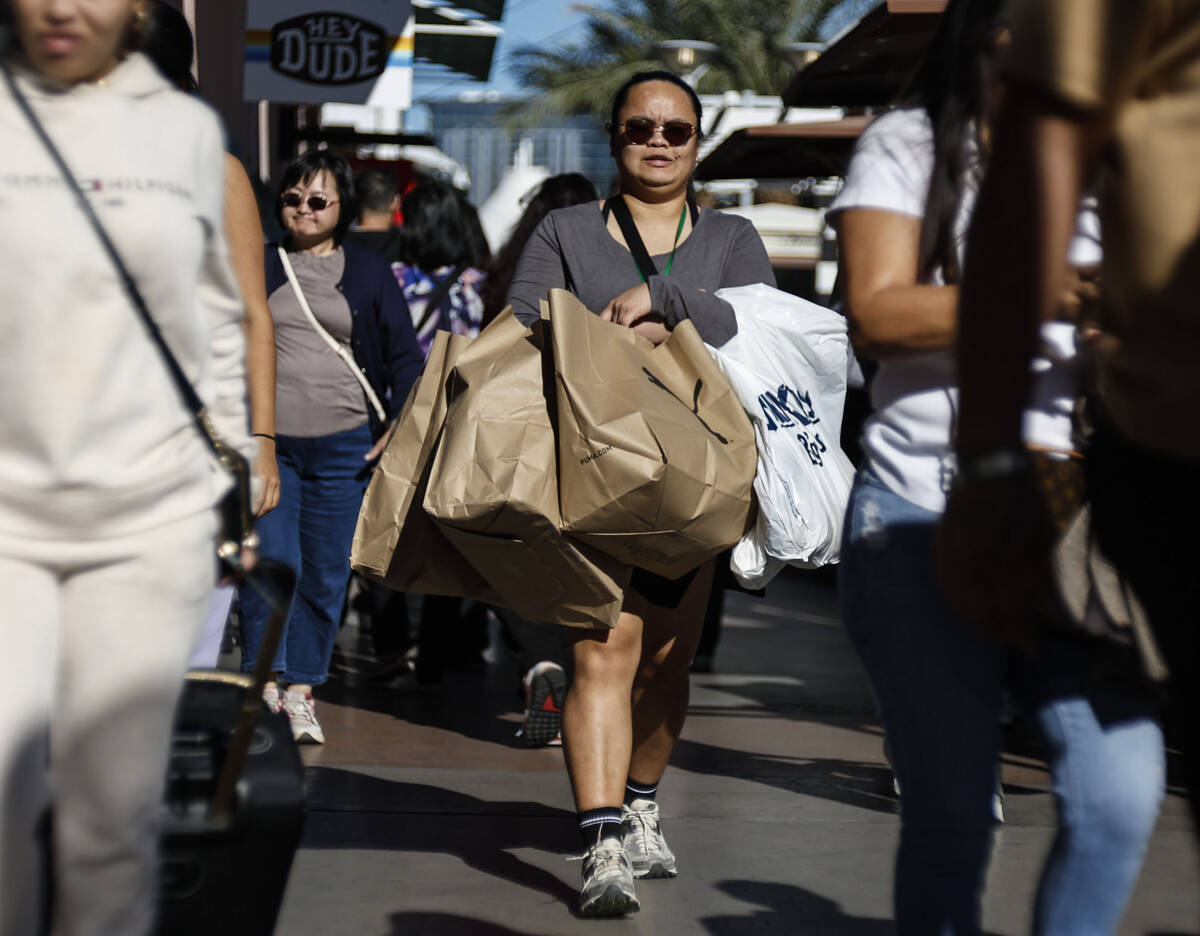 People shop during Black Friday at Las Vegas North Premium Outlets Friday, Nov. 28, 2025 in Las ...