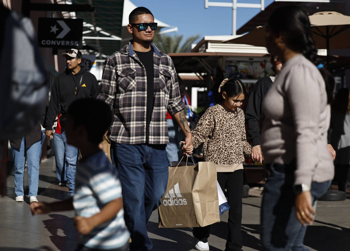 People shop during Black Friday at Las Vegas North Premium Outlets Friday, Nov. 28, 2025 in Las ...