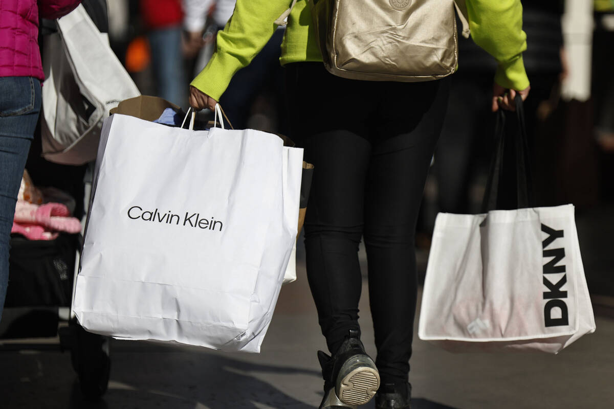 People shop during Black Friday at Las Vegas North Premium Outlets Friday, Nov. 28, 2025 in Las ...