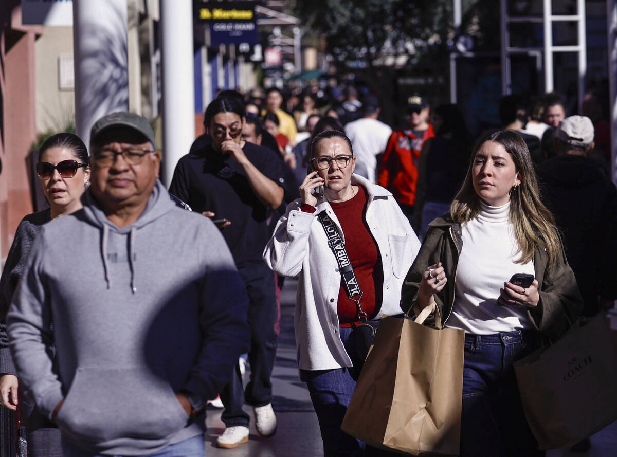 People shop during Black Friday at Las Vegas North Premium Outlets Friday, Nov. 28, 2025 in Las ...