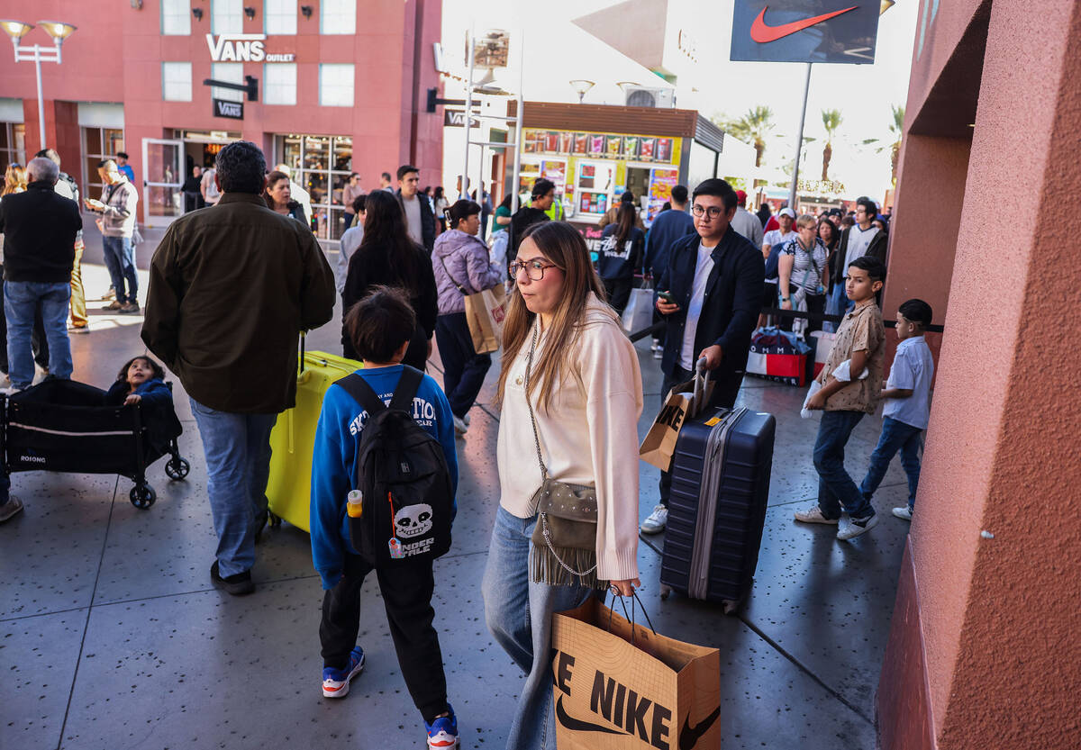 People shop during Black Friday at Las Vegas North Premium Outlets Friday, Nov. 28, 2025 in Las ...