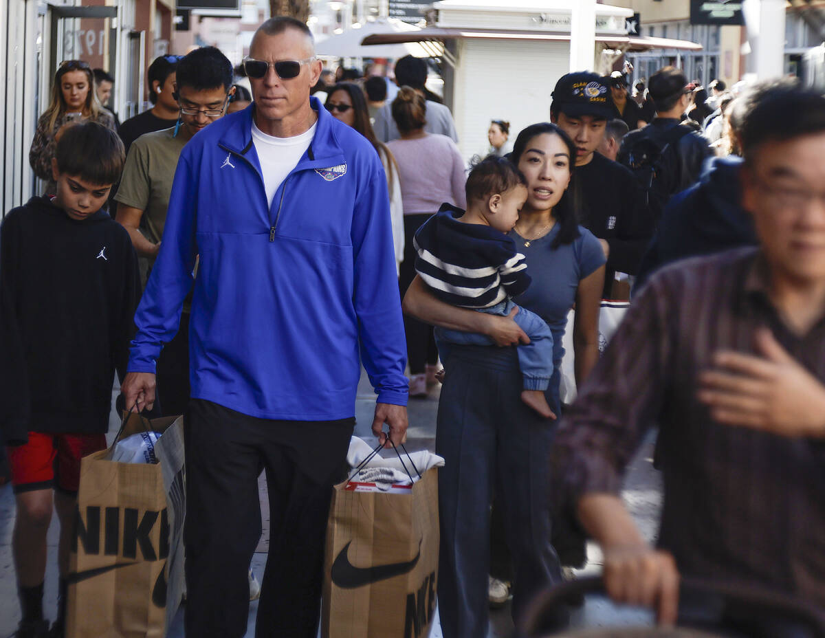 People shop during Black Friday at Las Vegas North Premium Outlets Friday, Nov. 28, 2025 in Las ...