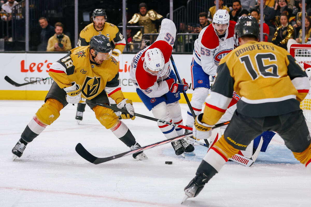 Golden Knights center Tomas Hertl (48) tries to make a shot around multiple players during the ...