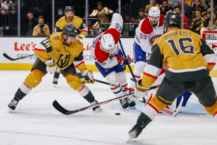 Golden Knights center Tomas Hertl (48) tries to make a shot around multiple players during the ...