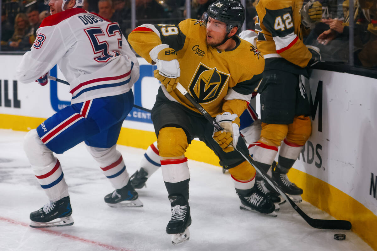 Golden Knights center Ivan Barbashev (49) looks for a place to pass the puck during the first p ...