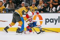 Golden Knights right wing Mark Stone (61) and Montréal Canadiens center Nick Suzuki (14) c ...