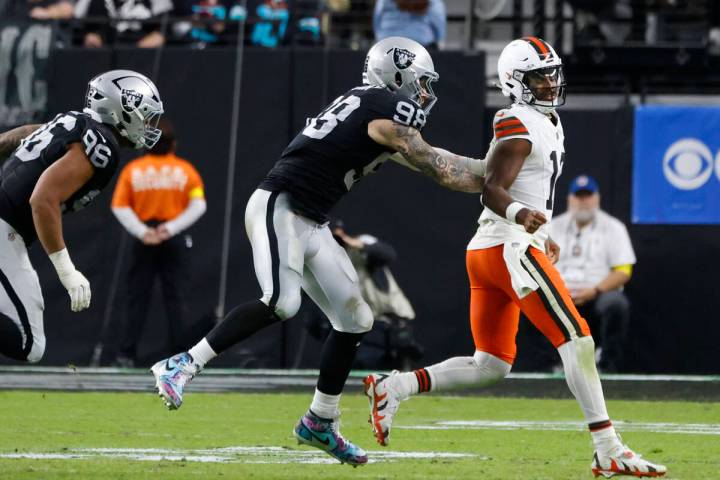 Cleveland Browns quarterback Shedeur Sanders (12) is chased by Raiders defensive end Maxx Crosb ...